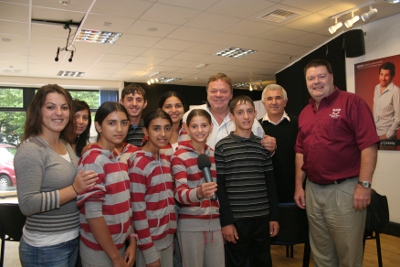 Choir at Radio Blackburn with Ted Robbinss.JPG